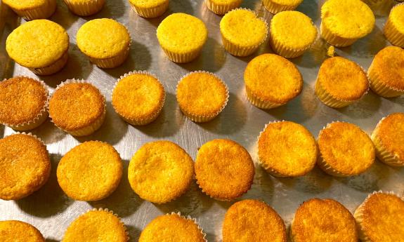 Fresh baked golden cornbread muffins in trays
